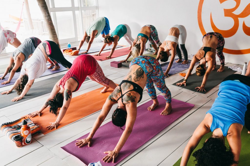 SwellWomen guests enjoy yoga in an open-aired studio