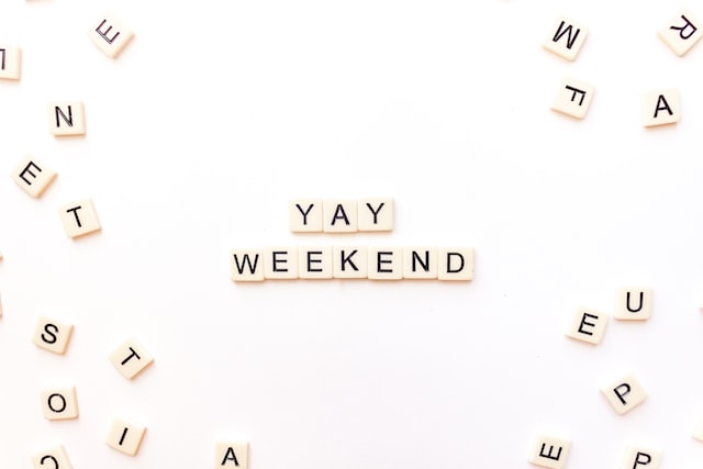 Scrabble letters spelling out “yay weekend.”
